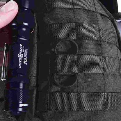 Close up of cable manager  in Molle system with torch next to it  - Black 