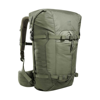 Three quarter front view of 28 litre Tasmanian Tiger Sentinel pack featuring two compression straps, front pocket, roll-top with zipper and laser-cut MOLLE on sides - Olive | TT7353.331