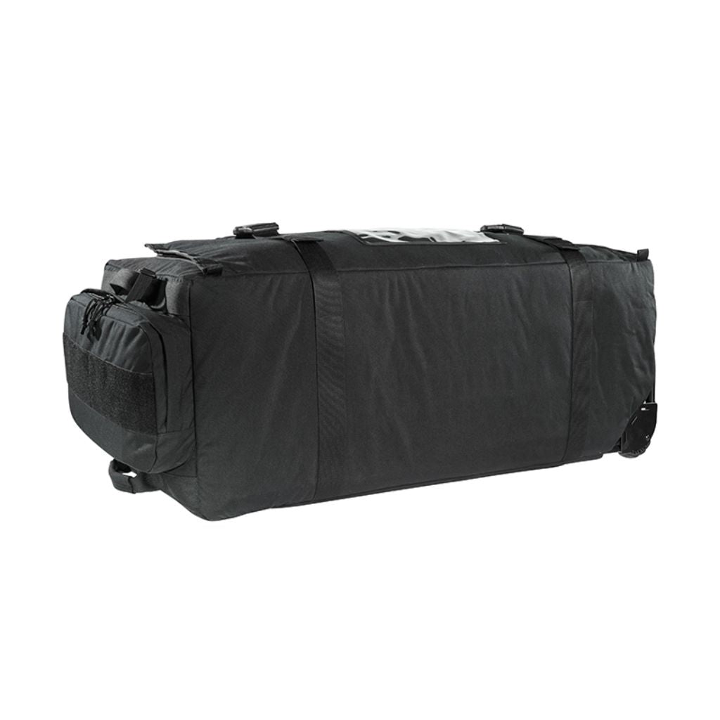 Left hand view of Tasmanian Tiger MIL Transporter, 190 litre deployment bag with large zipped accessible pocket, compression strap, handles at sides and small outside pouch - black