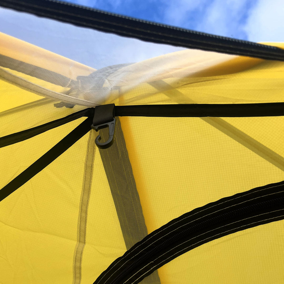 Close up of hook on interior roofline of Ascent 1 tent in yellow