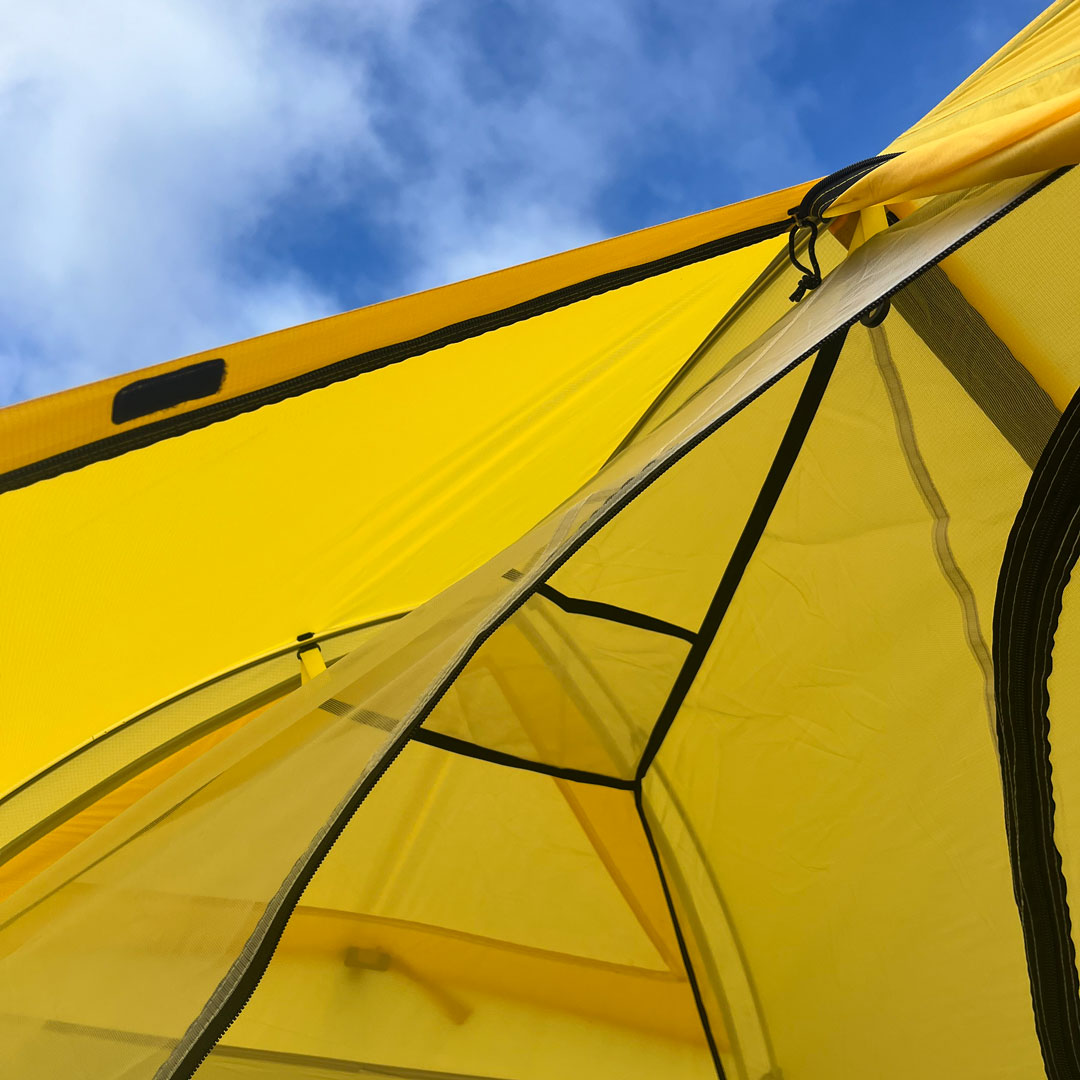 Close up of mesh liner on inside of yellow Ascent 1  tent