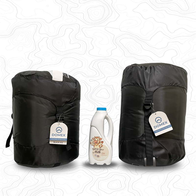 Scale image of Black Ice sleeping bag on left of 1 litre bottle of milk and Black Ice XL on the right | GENERAL