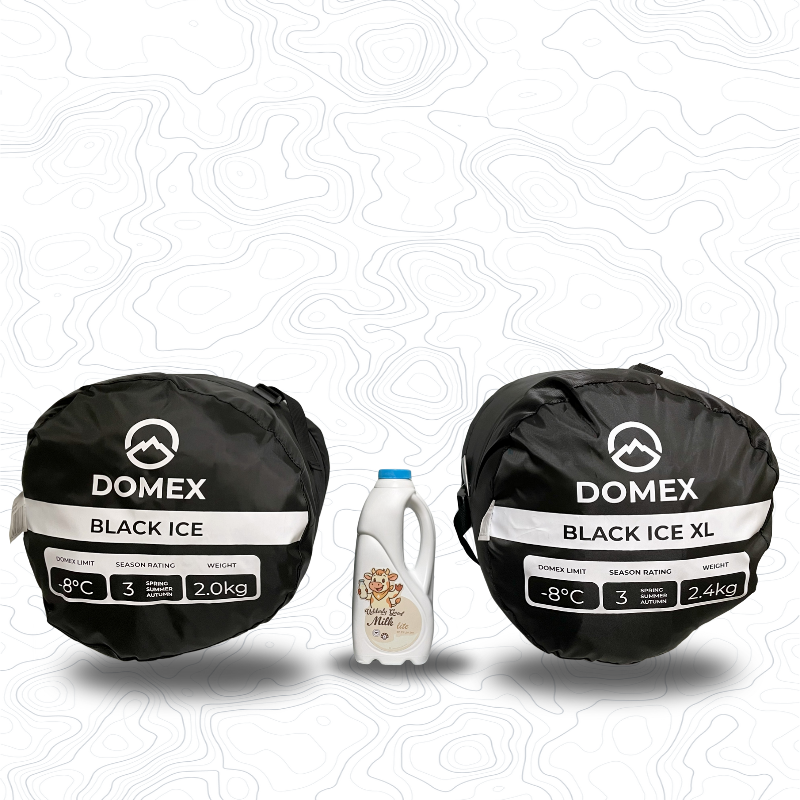 Scale image of Black Ice sleeping bag on left of 1 litre bottle of milk (showing -8C and 2.0kg) and Black Ice XL on the right (showing -8C and 2.4kg) | GENERAL