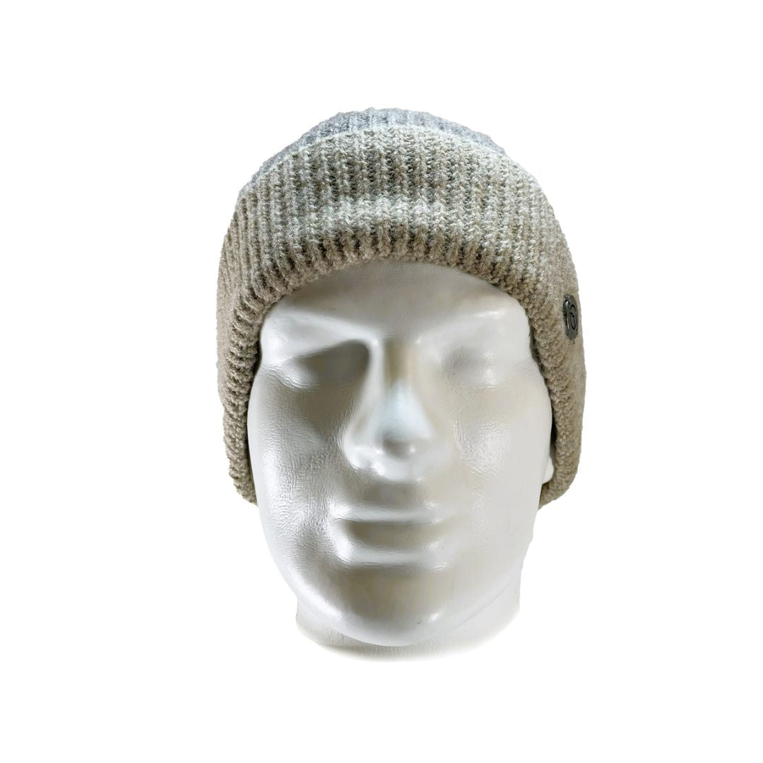 Front view of Domex Soft pink and taupe stripe cuffed beanie with a plush finish and a medallion badge
