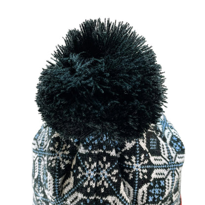 Close up of pom pom on Domex snowflake design cuffless knit beanie 