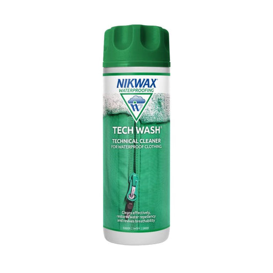 300ml bottle of NikWax Tech Wash. Bottle is white with a green lid. Label features a close up image of a zippered green jacket with foam at the top of the label | NW181