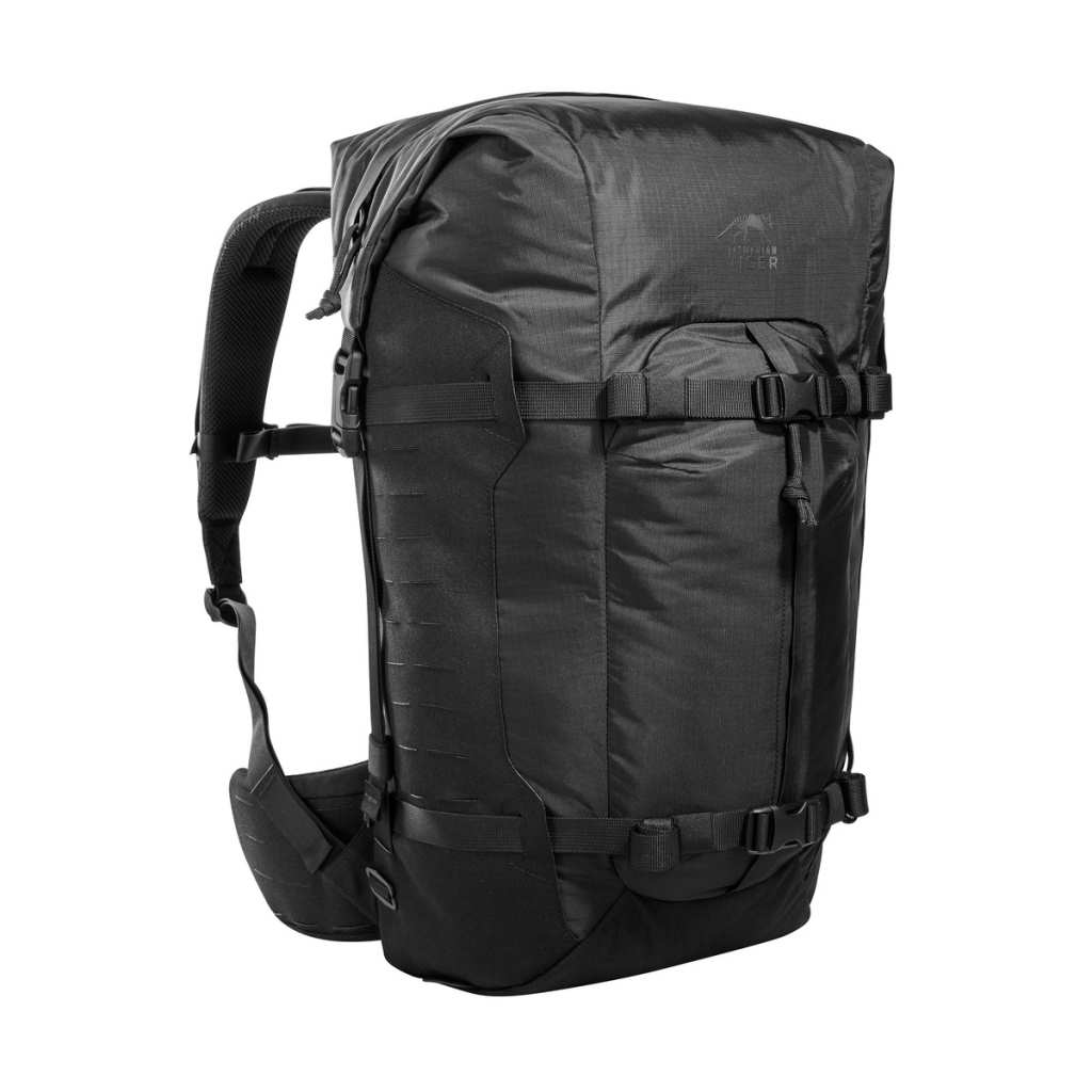 Three quarter front view of 28 litre Tasmanian Tiger Sentinel pack featuring two compression straps, front pocket, roll-top with zipper and laser-cut MOLLE on sides - Black. Ships Within New Zealand | TT7353.040