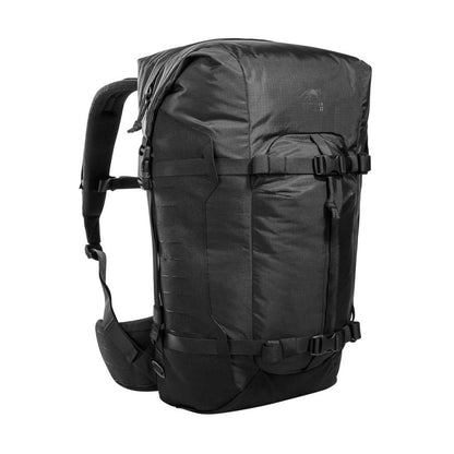 Three quarter front view of 28 litre Tasmanian Tiger Sentinel pack featuring two compression straps, front pocket, roll-top with zipper and laser-cut MOLLE on sides - Black. Ships Within New Zealand | TT7353.040