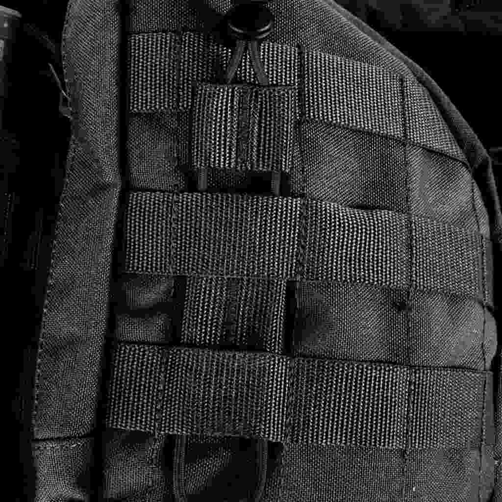 Close up of tourniquet in Molle system  - Black 