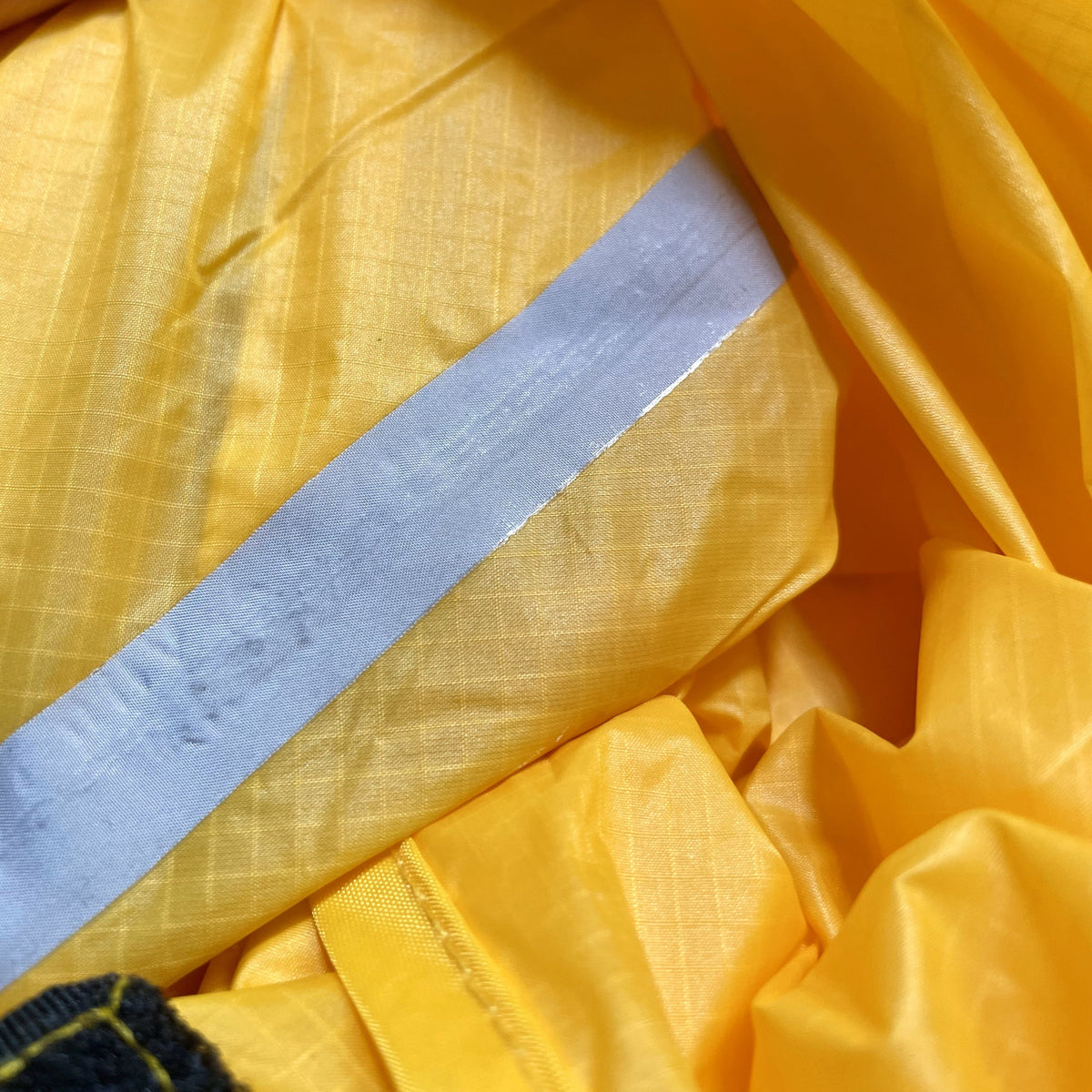 Close up of sealed seam on Domex Ascent1 1 Tent in yellow